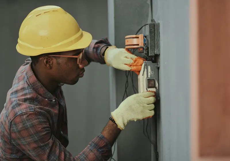 Electrician working on a home electrical system